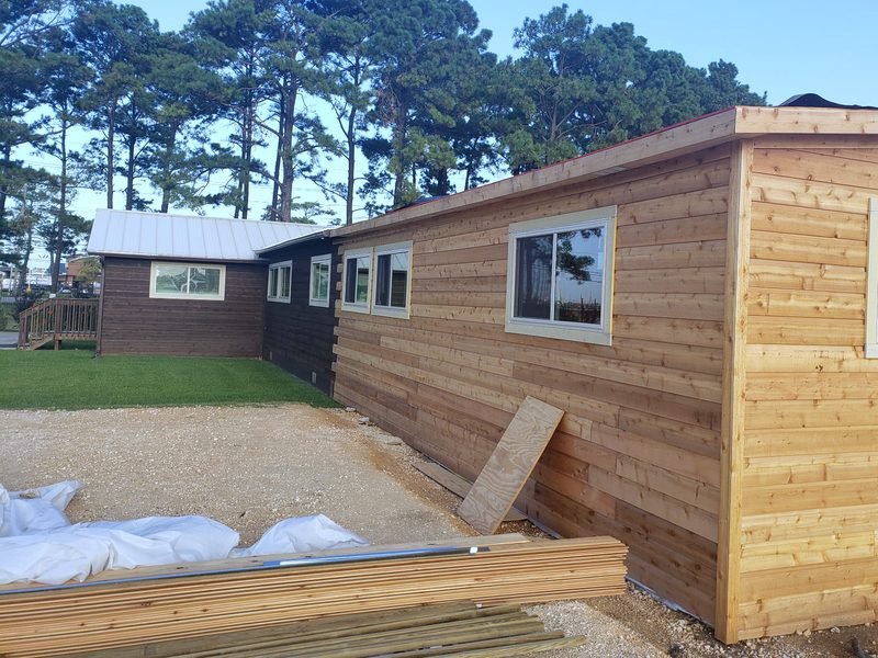 Cedar-clad home addition completed by Level Headed Construction.